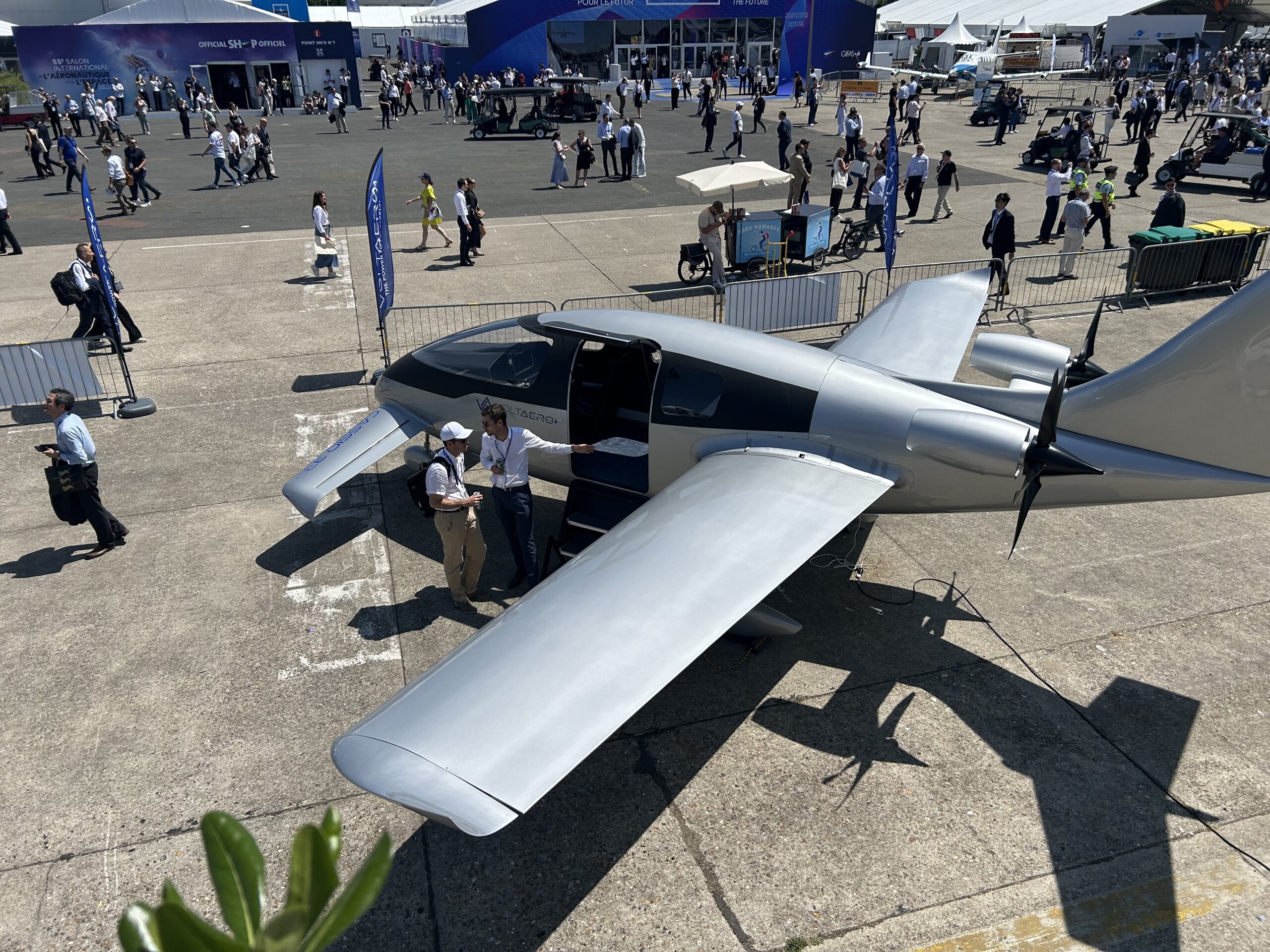 Voltaero Cassio 330 at a busy airshow showing off to media and passerbys